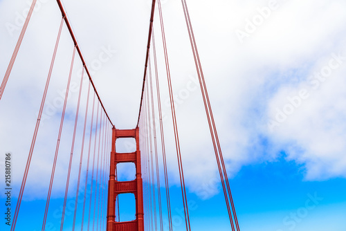 Golden Gate Bridge on a beautiful sunny day with blue sky and clouds in summer - San Fancisco Bay Area,  Golden Gate National Recreation Area, California, USA photo