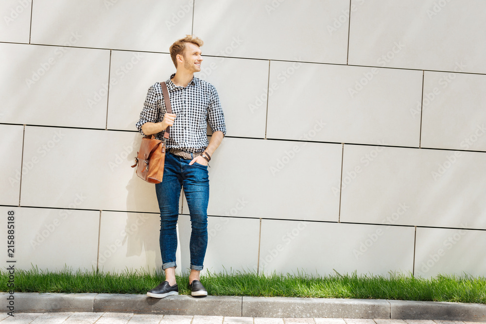 Great mood. Pleasant nice man putting his hand in the pocket while being on his way to work Great mood. Pleasant nice man putting his hand in the pocket while being on his way to work