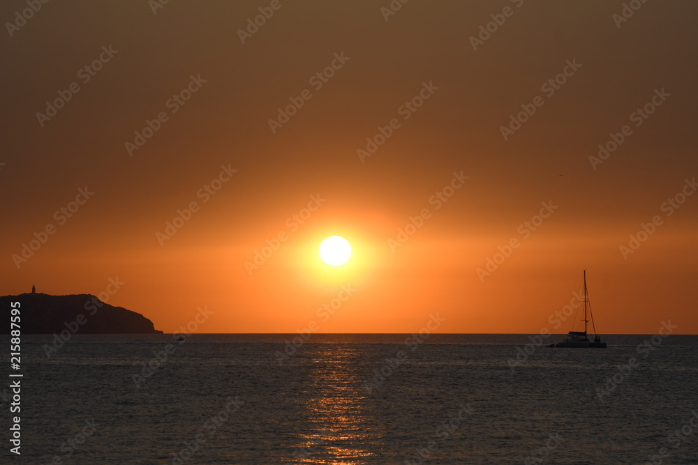 The sun at sunset over the sea of Ibiza