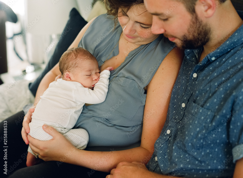 Mother and father adoring their newborn son Mother and father adoring their newborn son