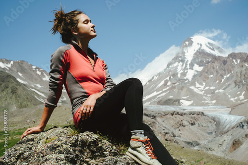 Young woman hiking in the mountains photo