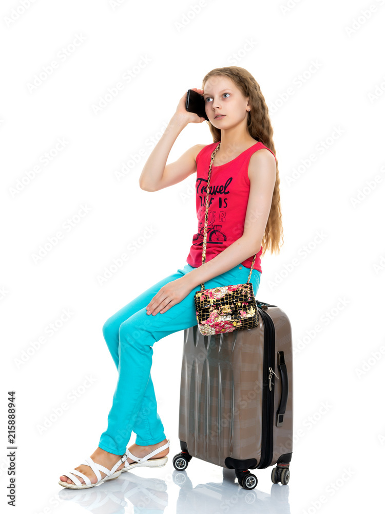 The girl is using a cell phone. The girl is using a cell phone.