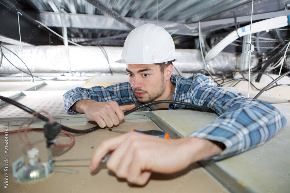 man repairing electrical wiring on the ceiling man repairing electrical wiring on the ceiling