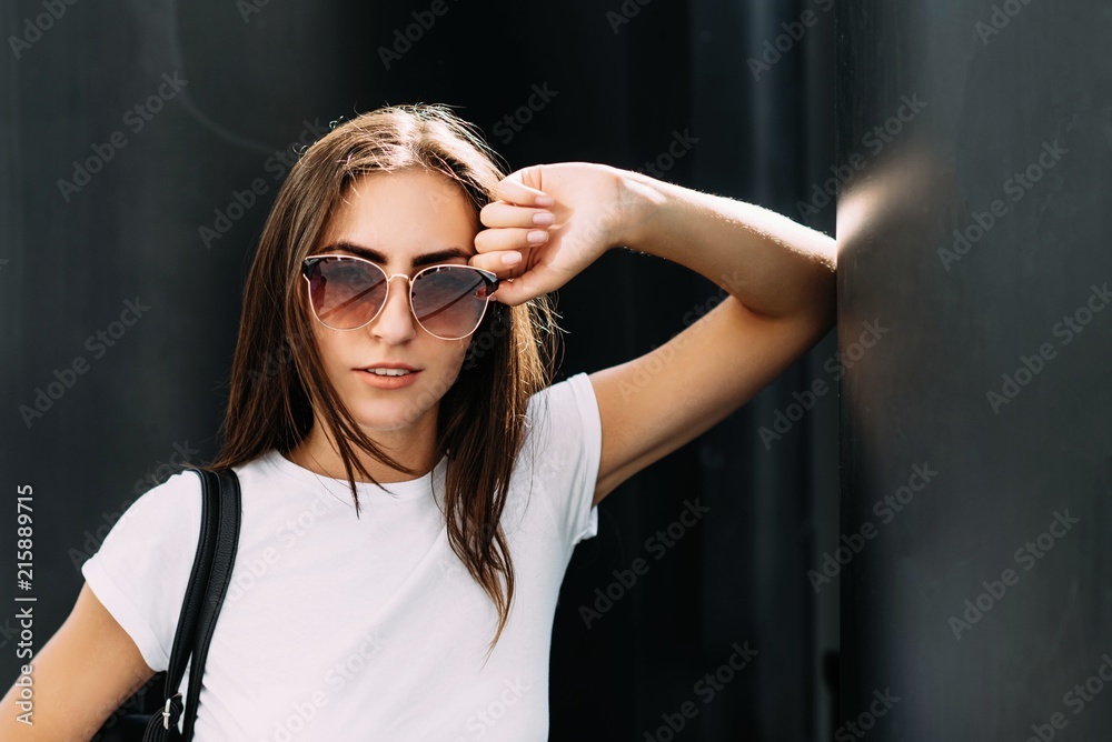 The young pretty girl is actively spending time on the street The young pretty girl is actively spending time on the street