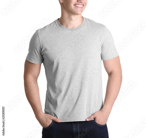 Young man in grey t-shirt on white background. Mockup for design