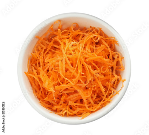 Bowl with grated ripe carrot on white background