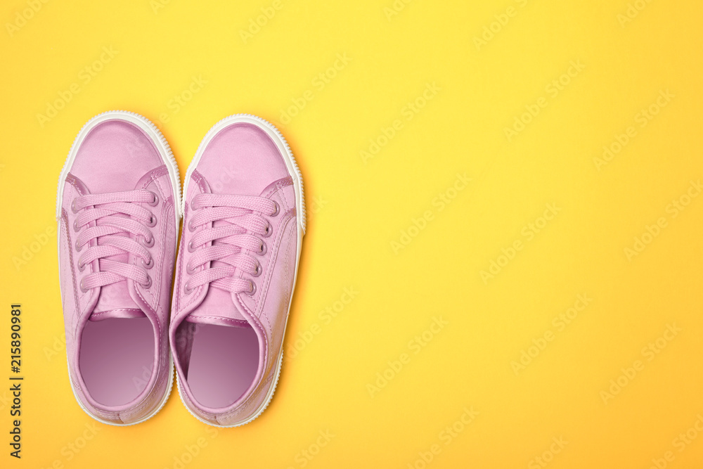 Stylish new shoes on color background, top view Stylish new shoes on color background, top view