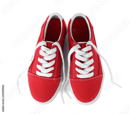 Pair of stylish new shoes on white background, top view