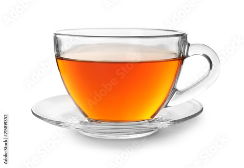 Glass cup of hot aromatic tea on white background