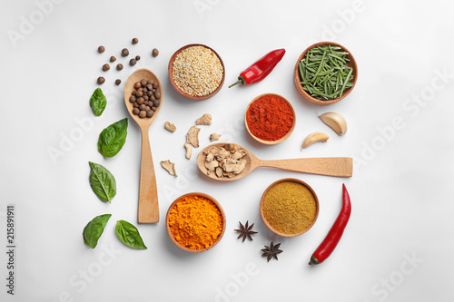 Fototapeta Naklejka Na Ścianę i Meble -  Beautiful composition with different aromatic spices on white background