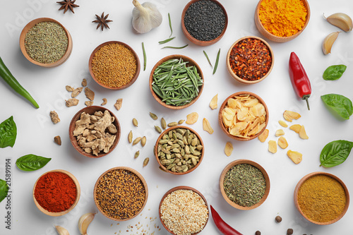 Fototapeta Naklejka Na Ścianę i Meble -  Beautiful composition with different aromatic spices on white background