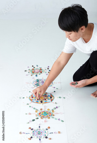 Mandala pattern with crystal and Asian women. a creator photo