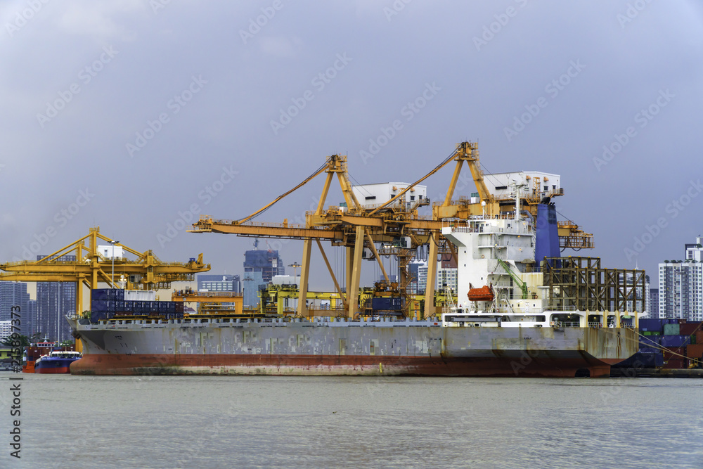 Container Cargo freight ship with working crane bridge for export and import in the sea