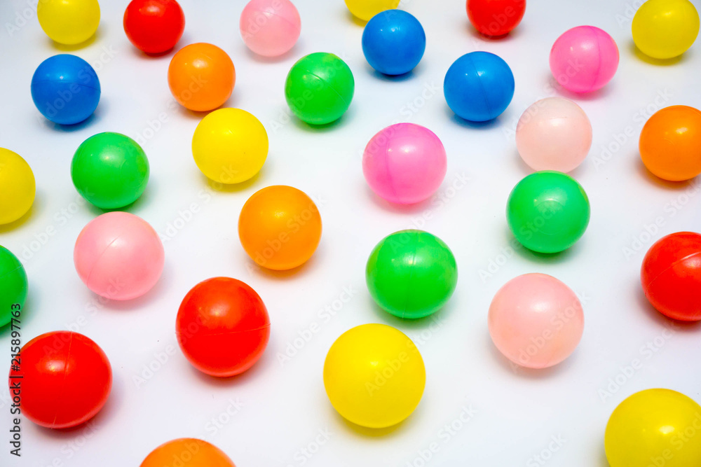 colorful plastic balls on a white background colorful plastic balls on a white background