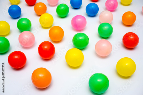 colorful plastic balls on a white background