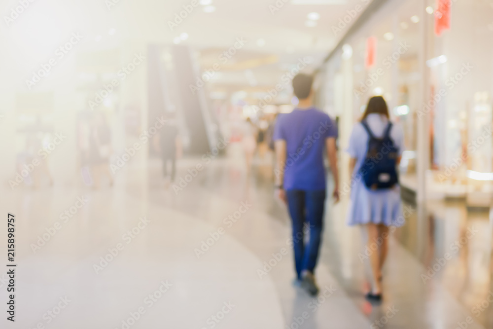 abstract blurred people walking or standing in street shopping center use us background