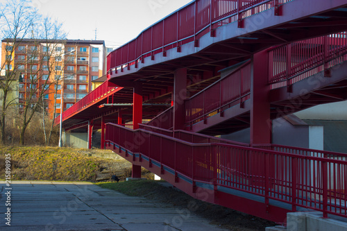 New red bridge over railway and block of flats photo