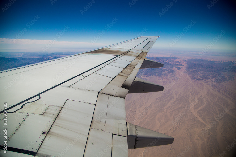 The wing of the airplane in the air The wing of the airplane in the air
