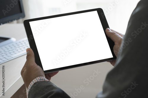 Digital tablet computer close up man using tablet hands man multitasking with isolated screen