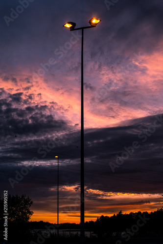 Lone lamppost under a sunset