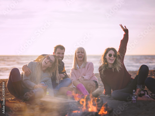 Friends having fun at beach on autumn day © .shock