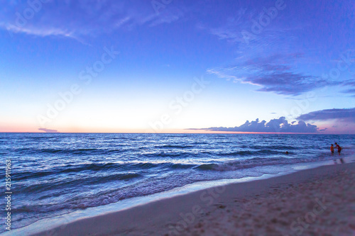 Panoramic view of a Beach in Naples at early morning with the sun coming up in a summer sunny day, Florida, USA.