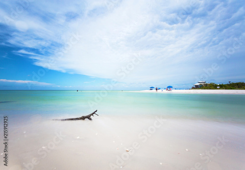 Fototapeta Naklejka Na Ścianę i Meble -  Panoramic view of a Beach in Naples at early morning with the sun coming up in a summer sunny day, Florida, USA.