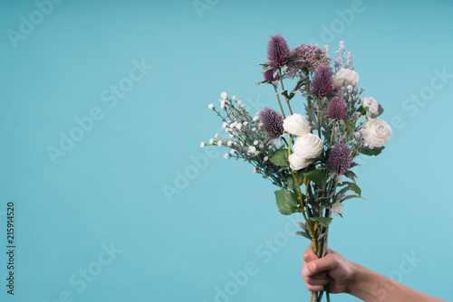 wild and beautiful flower bouquet on light background.