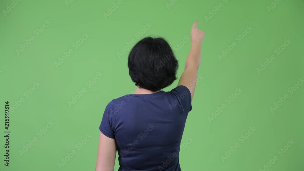 Beautiful woman with short hair pointing finger Beautiful woman with short hair pointing finger