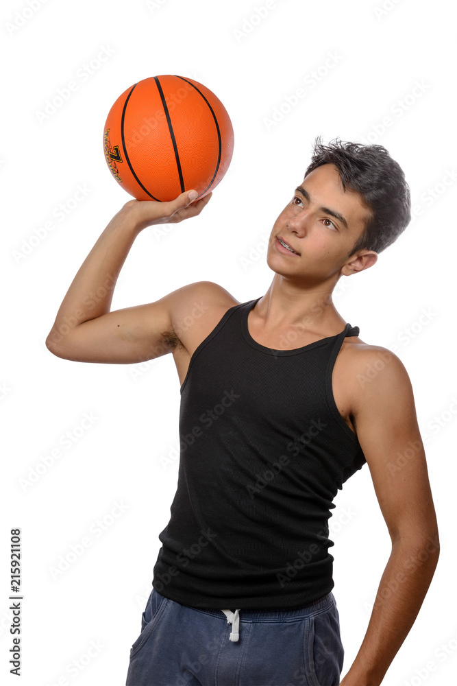 Teenager with sportswear playing basketball. White background. Teenager with sportswear playing basketball. White background.