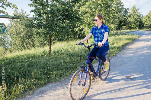 Young woman riding a bike