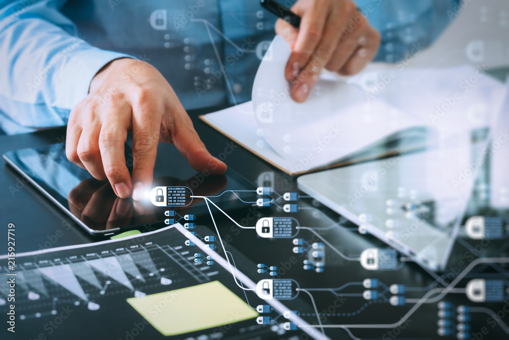 close up of businessman working with smart phone and digital tablet and laptop computer on wooden desk in modern office with glass reflected view close up of businessman working with smart phone and digital tablet and laptop computer on wooden desk in modern office with glass reflected view