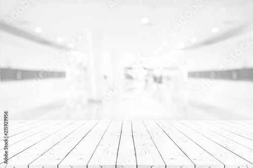 Perspective empty white wooden table on top over blur background, can be used mock up for montage products display or design layout.