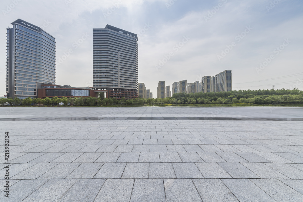 Panoramic skyline and modern business office buildings with empty road,empty concrete square floor