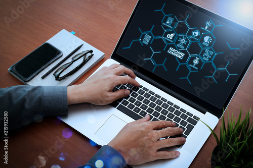 top view of  businessman hand working with new modern blank screen computer and smartphone on blank book as concept