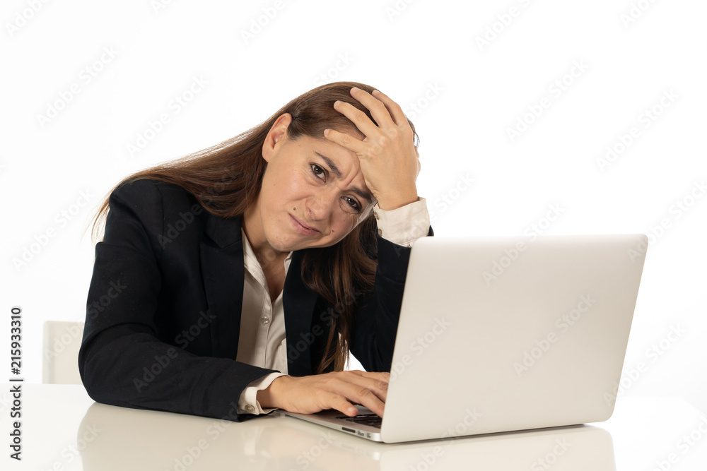 Young beautiful business woman suffering stress working at office computer desk feeling tired and desperate looking overworked overwhelmed and frustrated. In business education, fail and technology