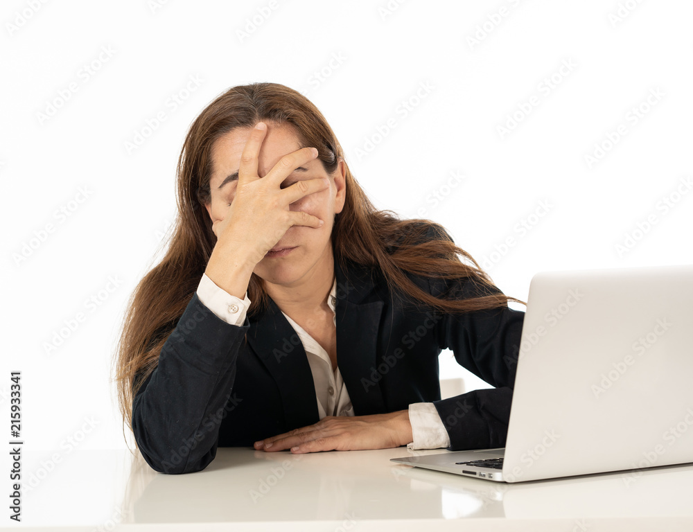 Young beautiful business woman suffering stress working at office computer desk feeling tired and desperate looking overworked overwhelmed and frustrated. In business education, fail and technology Young beautiful business woman suffering stress working at office computer desk feeling tired and desperate looking overworked overwhelmed and frustrated. In business education, fail and technology