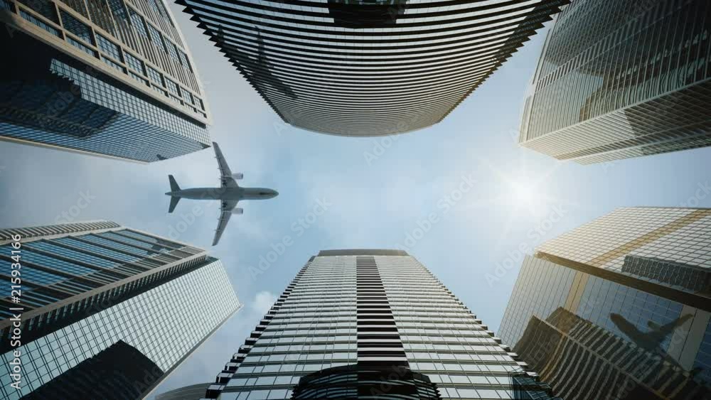 Bottom view airplane flying over skyscrapers and reflects in glass modern facades.  High rise city centre corporate buildings central composition.