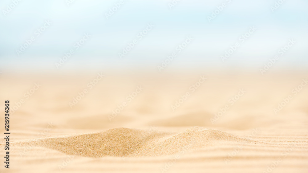 Close up sand beach with blurred sea sky background, summer day, copy space. - obrazy, fototapety, plakaty 