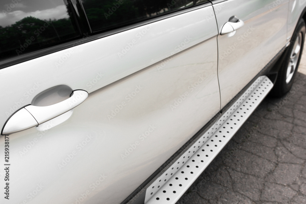 Part of the gray car. Car doors and car handles Part of the gray car. Car doors and car handles