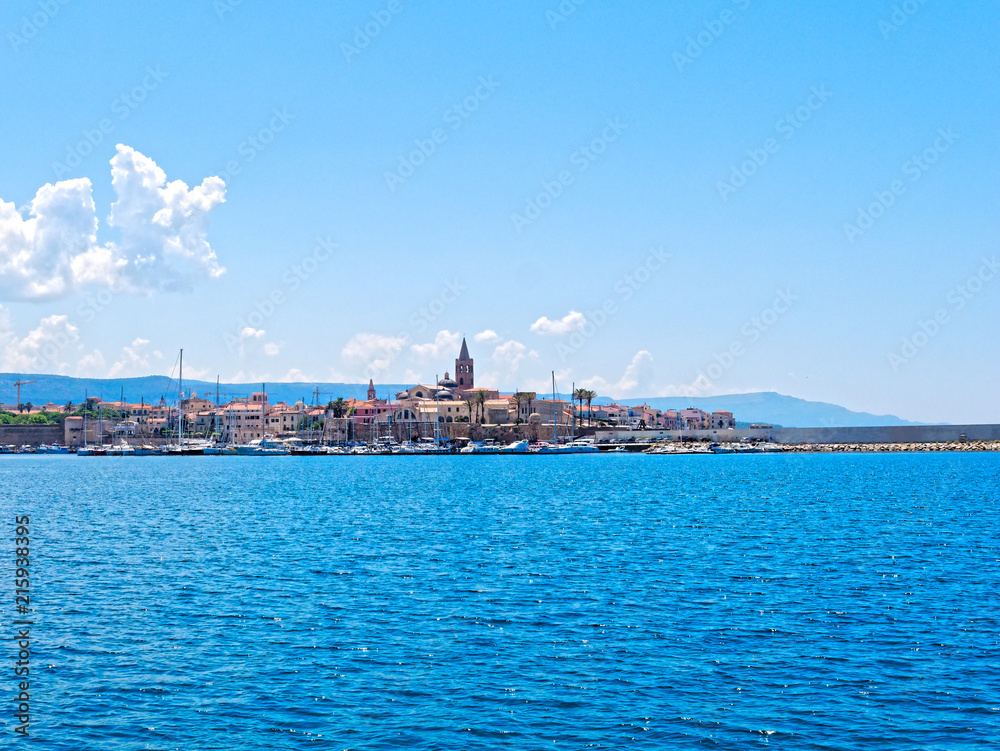 View of the city of Alghero. Shot from the sea. Sardinia, Italy.