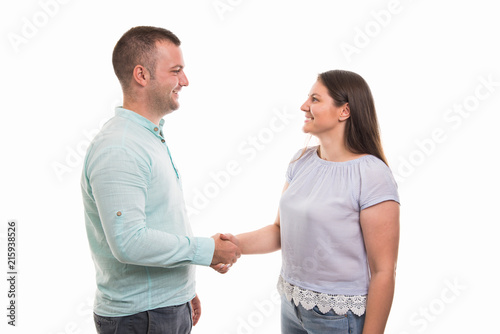 Portrait of young happy couple handshaking