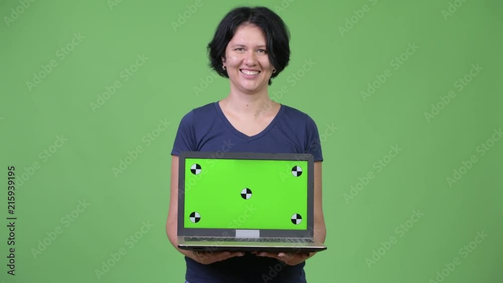 Beautiful woman with short hair showing laptop Beautiful woman with short hair showing laptop