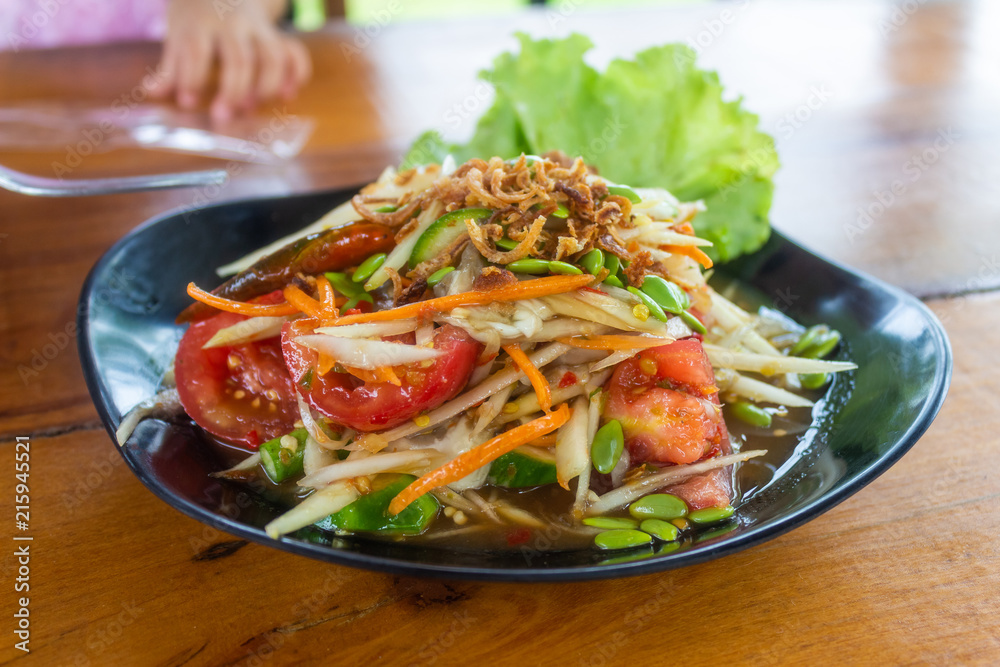 Thai papaya salad hot and spicy mixed from variety of vegetable Thai papaya salad hot and spicy mixed from variety of vegetable