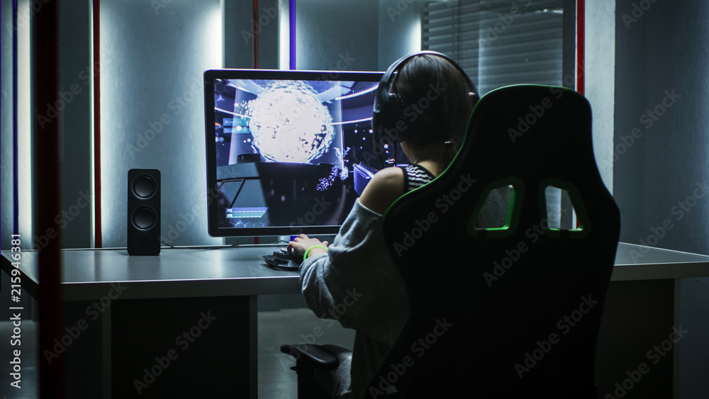 Man gamer teaching his girlfriend playing space shooter video game on RGB  powerful personal computer. Pro cyber woman with headset performing video  games streaming from home during online tournament Stock Photo 