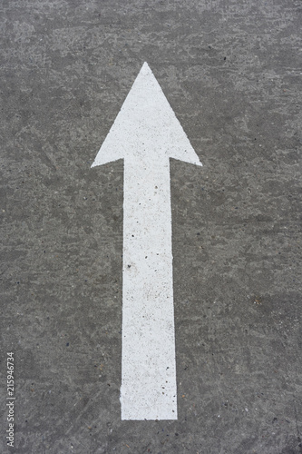 white arrow concrete direction sign © DSGNSR