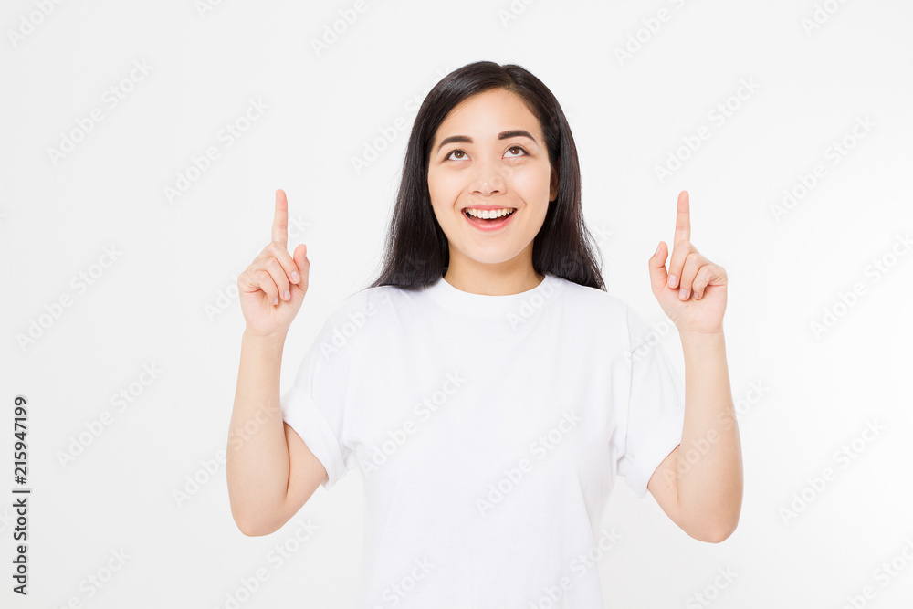 Portrait of smiling young asian woman wearing summer t shirt pointing at copy space by finger isolated on white template and blank background. Portrait of smiling young asian woman wearing summer t shirt pointing at copy space by finger isolated on white template and blank background.