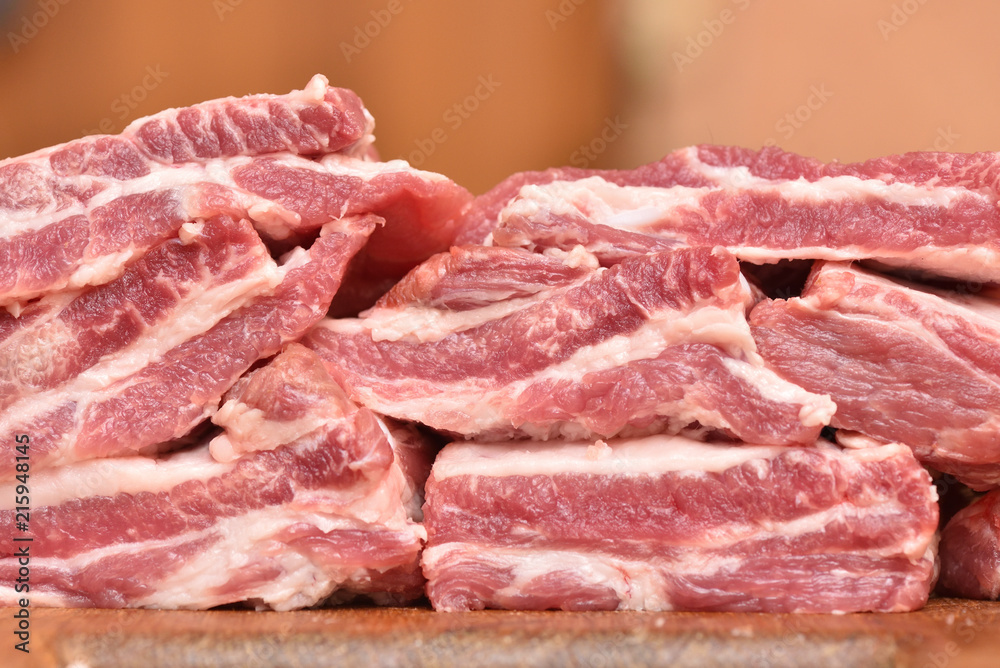 Beautiful and fresh pork meat on a cutting board. Pork ribs for a delicious dinner. Close-up