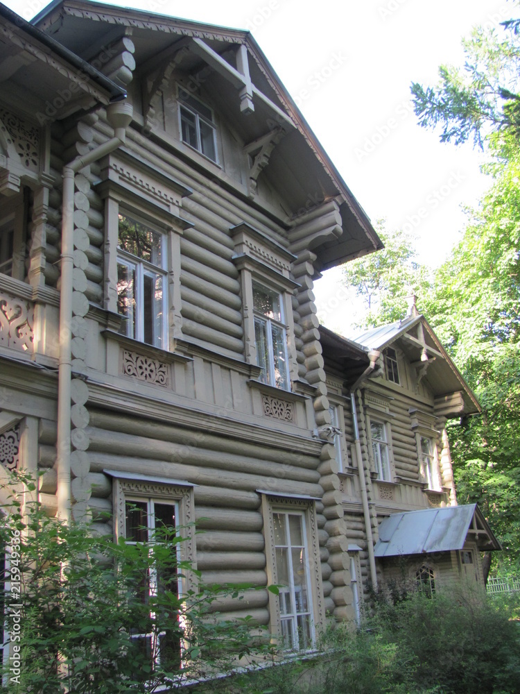 Fragment of an old wooden house in Russian style with carvings