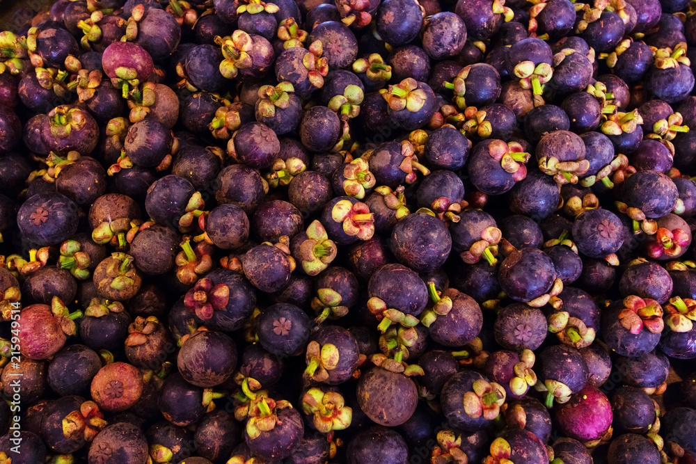 Fototapeta premium mangosteen type of tropical fresh fruits , heap of organic nutrition diet fruit at asian market in Thailand . common useful vitamin for good foods .